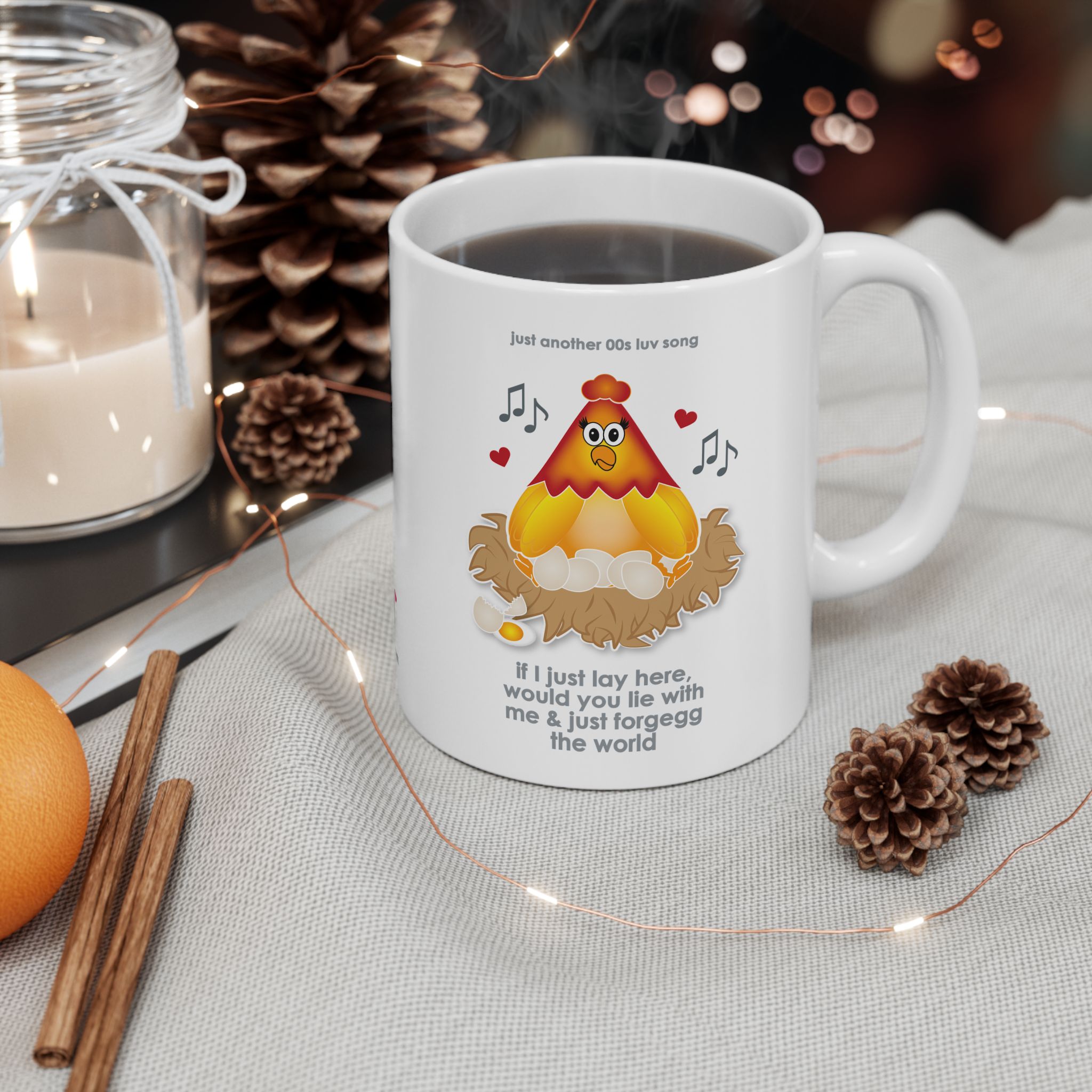 If I Lay Here Mug (11oz, 15oz) 4 White ceramic mug printed with a cartoon chicken on some eggs in a nest, text reads "if I just lay here, would you lie with me & just forgegg the world" on a table with pine cones, cinnamon sticks, a candle, an orange and fairy lights