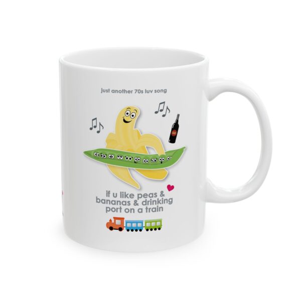 White ceramic Peas and Bananas Love Song Mug 11oz right view printed with a grinning banana, a pod of surprised peas and a toy train. Text reads "if u like peas & bananas and drinking port on a train"