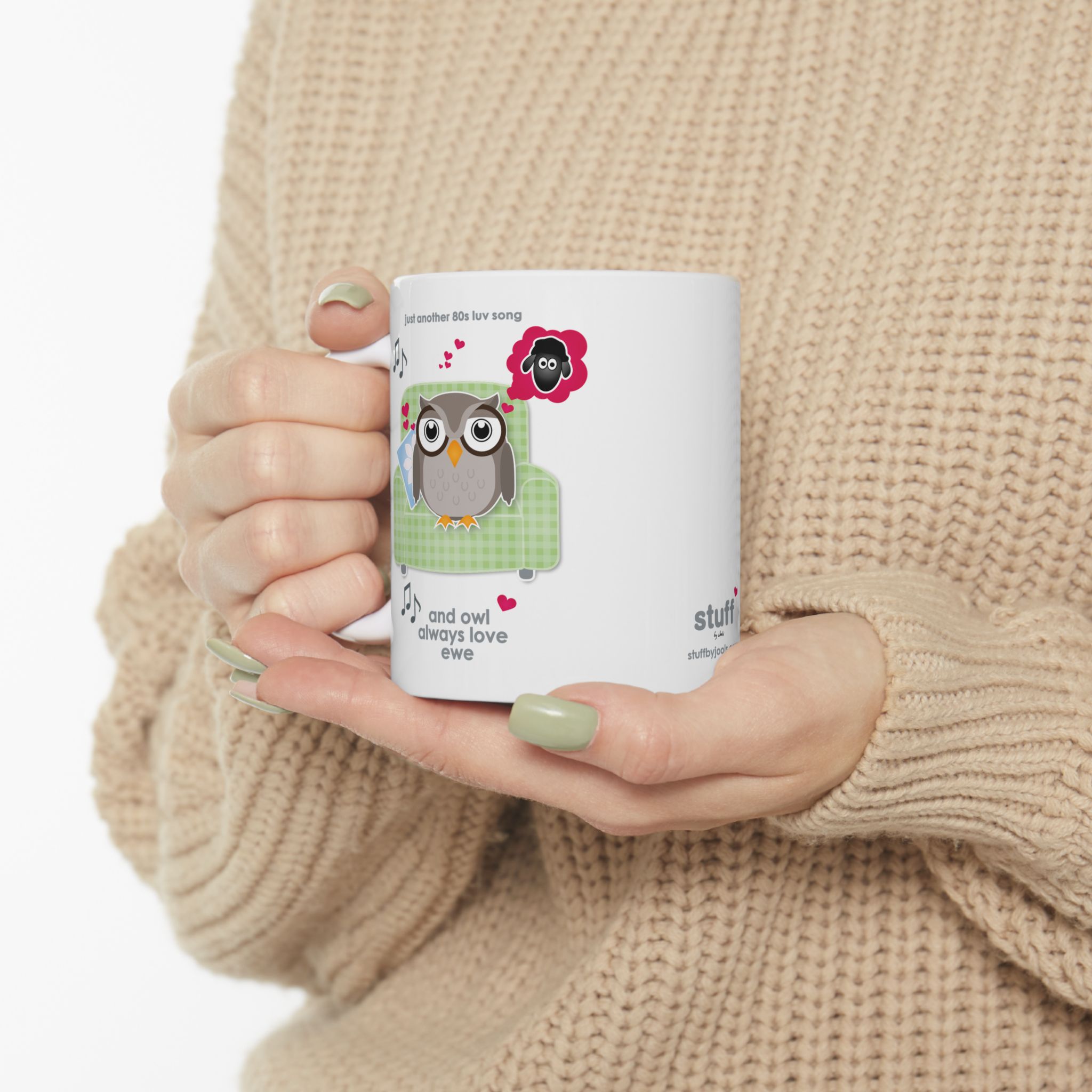 Owl Always Love Ewe Love Song Mug (11oz, 15oz) 7 White ceramic Owl Always Love Ewe Love Song Mug, printed with an owl sitting on a green chair, dreaming of a sheep. Text reads "Owl Always Love Ewe", held by woman in camel-coloured jersey