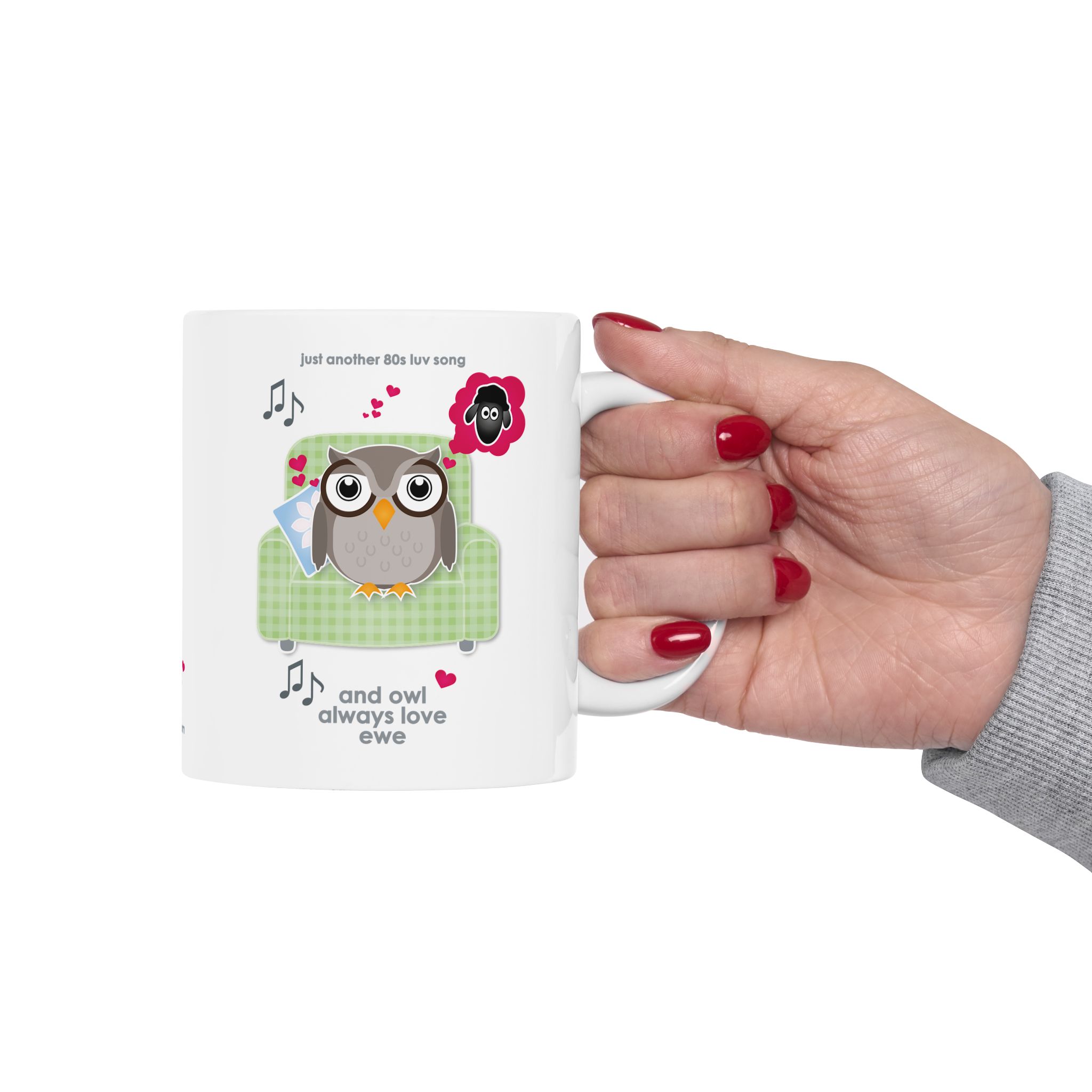 Owl Always Love Ewe Love Song Mug (11oz, 15oz) 5 White ceramic Owl Always Love Ewe Love Song Mug, printed with an owl sitting on a green chair, dreaming of a sheep. Text reads "Owl Always Love Ewe", held by woman's hand with red nail polish