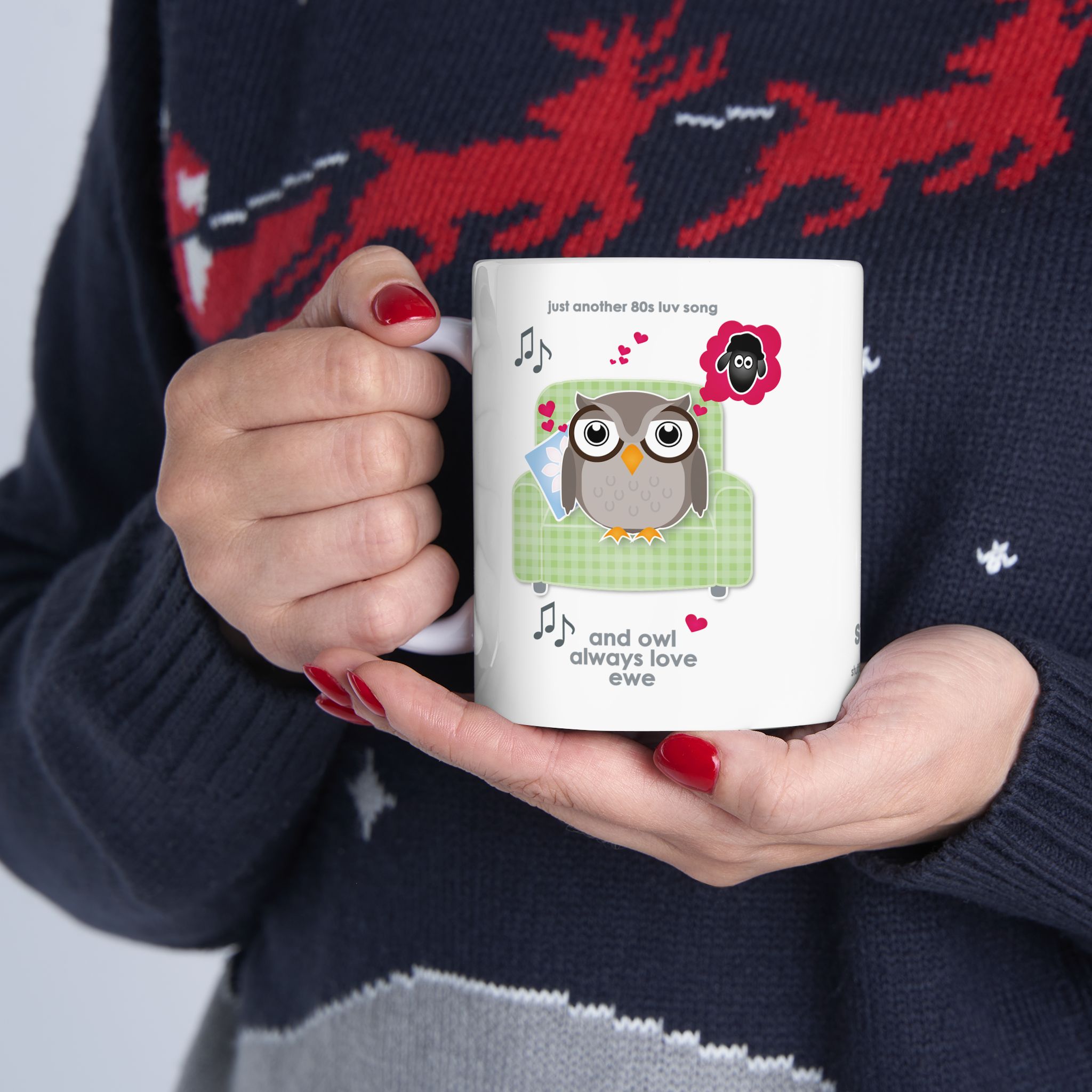 Owl Always Love Ewe Love Song Mug (11oz, 15oz) 6 White ceramic Owl Always Love Ewe Love Song Mug, printed with an owl sitting on a green chair, dreaming of a sheep. Text reads "Owl Always Love Ewe", held by woman in Christmas jersey